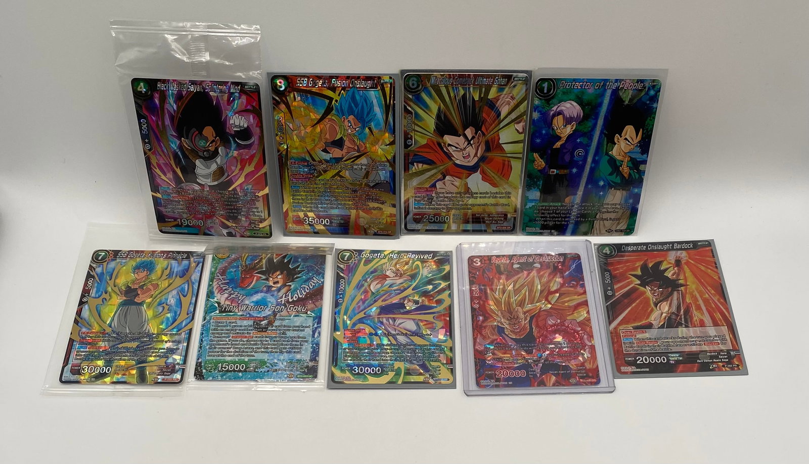 Dragon Ball Super TCG 8-Card High-Rarity Foil Lot - Gogeta, Vegeta, Goku: An exceptional collector's lot featuring eight (8) premium, high-rarity holographic and SPR/SR cards from the Dragon Ball Super Card Game. Cards Included: Top Row (Left to Right): Black Masked Saiyan,