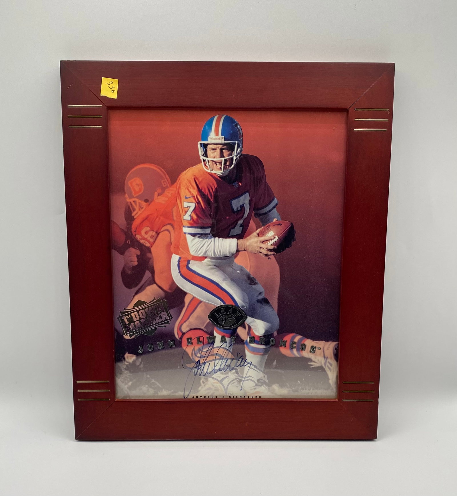 John Elway Signed 1997 Framed Photo – Denver Broncos – Certified Authentic Signature: John Elway Signed 1997 Leaf "1st Down Marker" Framed Photo – Denver Broncos – Certified Authentic Signature