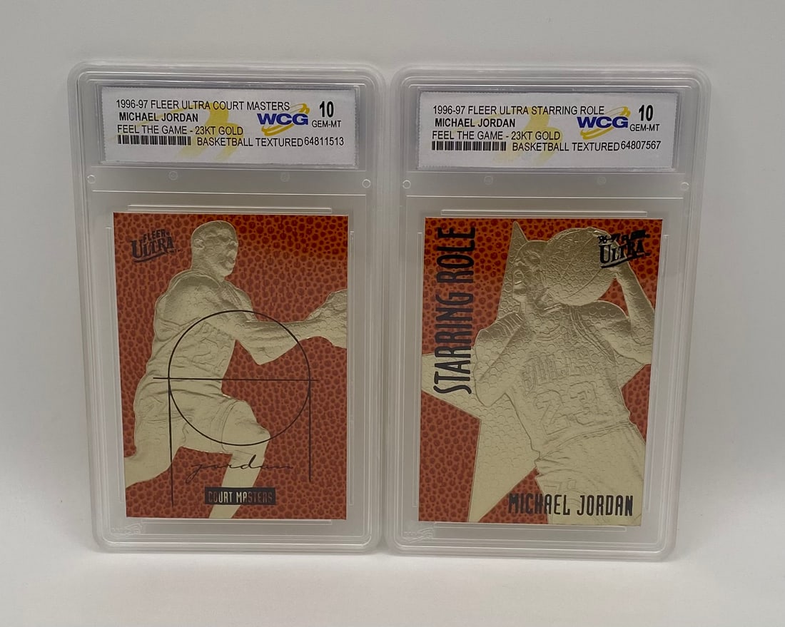 1996-97 Fleer Ultra Michael Jordan 23KT Gold Textured Cards – Pair (2): An incredibly tactile pair of 1996-97 Fleer Ultra commemorative 23-Karat Gold cards highlighting Chicago Bulls legend Michael Jordan. Both cards utilize a unique "Feel the Game" deeply dimpled,