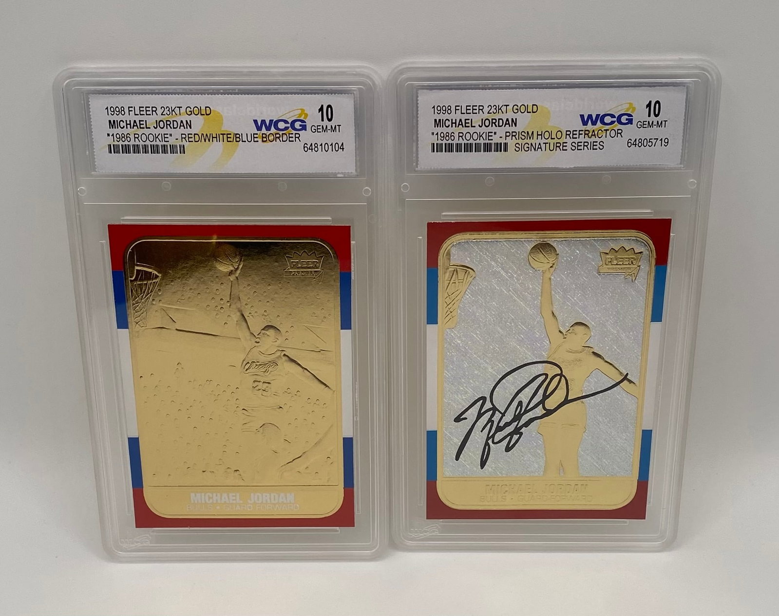 (2) 1998 Fleer Michael Jordan 23KT Gold 1986 Rookie Tributes: Prism & RWB: Manufacturer/Brand: Fleer / WCG Encapsulated Player: Michael Jordan Set: 1986 Rookie Retro Tributes (1998 Release) Variations Included: Red/White/Blue Border & Prism Holo Refractor Signature Series Ma