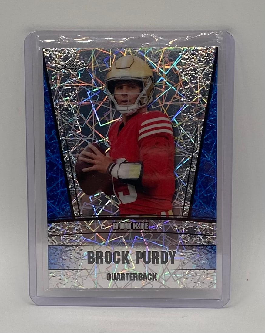 Brock Purdy Draft Rookie Cracked Ice /20: Player: Brock Purdy Year/Brand: 2022 Leaf Draft Football Card Type: Rookie Card Parallel/Variant: Blue/Silver Shimmer Cracked Ice design Numbered /20