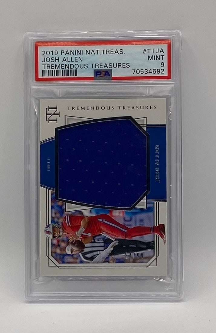 Josh Allen National Treasures Jersey Patch /99: Player: Josh Allen Year/Brand: 2019 Panini National Treasures Football Insert Series: Tremendous Treasures (#TTJA) Features: Authentic player-worn blue jersey memorabilia patch. Serial numbered