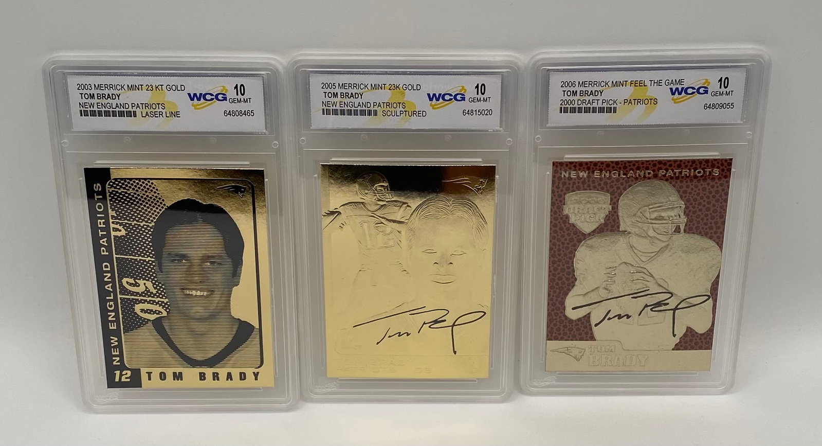 (3) Tom Brady 23KT Gold Metallic Cards - WCG Gem-MT 10 - 2003, 2005, 2006: A beautiful chronological trio of Tom Brady commemorative metallic gold cards from his championship era with the New England Patriots. All three cards are graded Gem-MT 10 by WCG. 2003 Merrick Mint 23