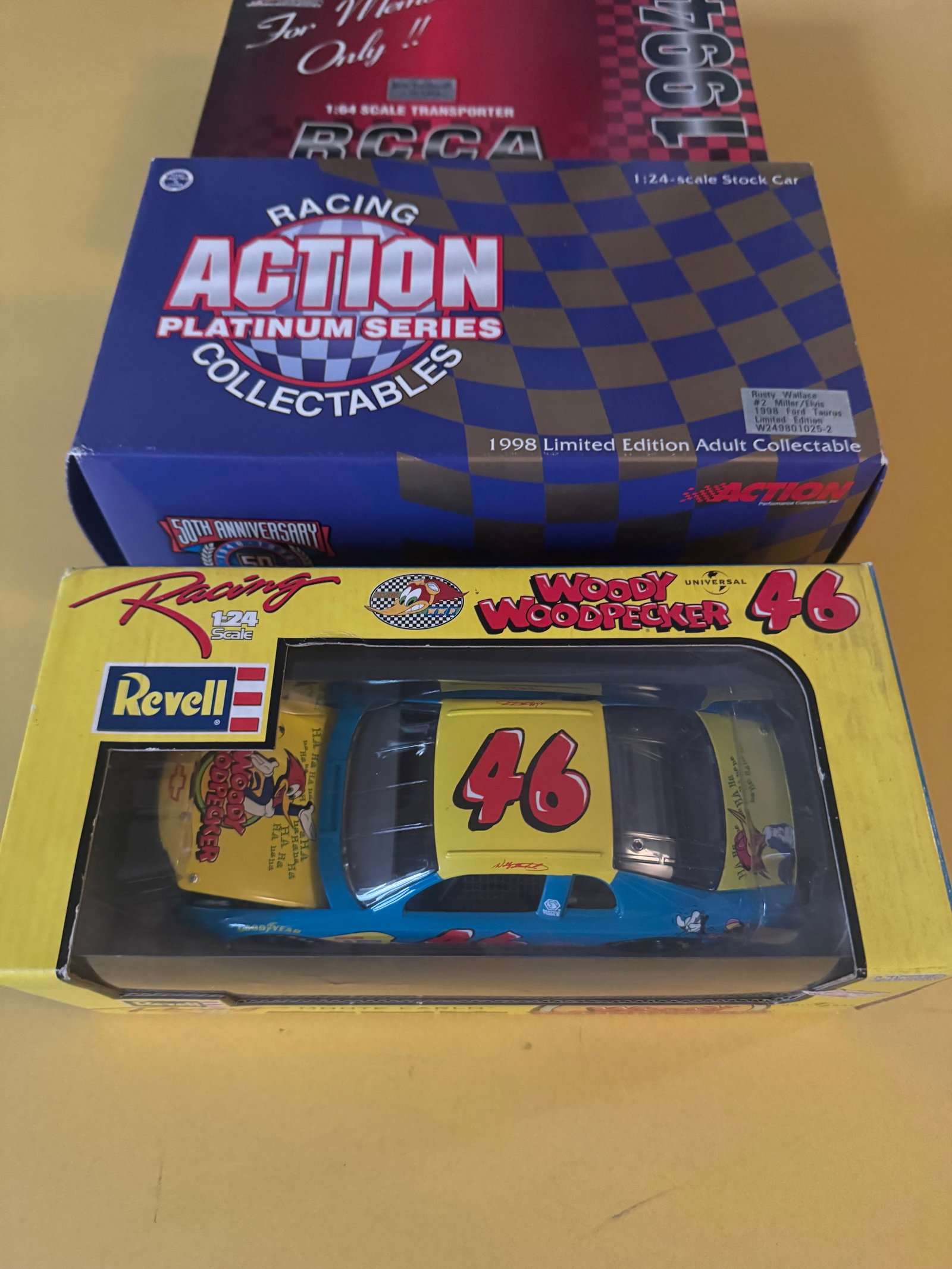 NASCAR Die-Cast Cars: Revell 1:24 Woody Woodpecker, Action 1:24 Rusty Wallace, RCCA 1:64 Transporter - 2