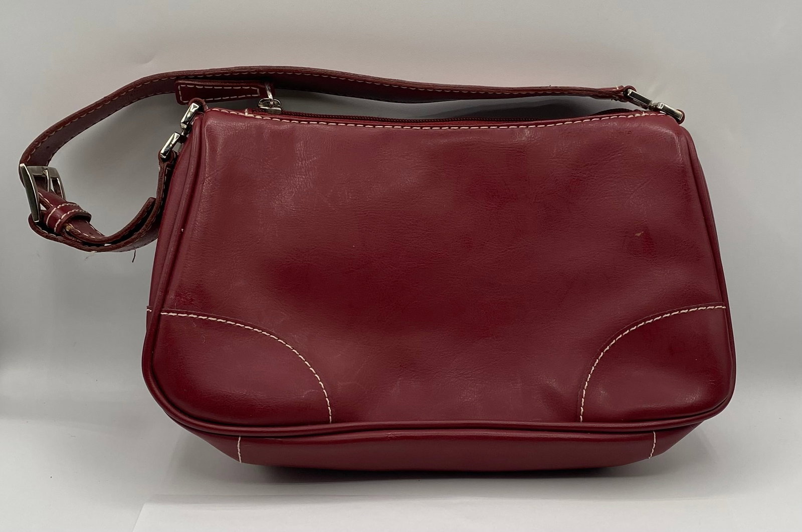 Vintage Prada Red Leather Shoulder Bag w/ Contrast Stitching: Brand: Prada (Milano) Material: Smooth leather exterior; classic black fabric-lined interior. Color: Deep Red / Burgundy with white contrast stitching. Hardware: Silver-tone hardware, including a side