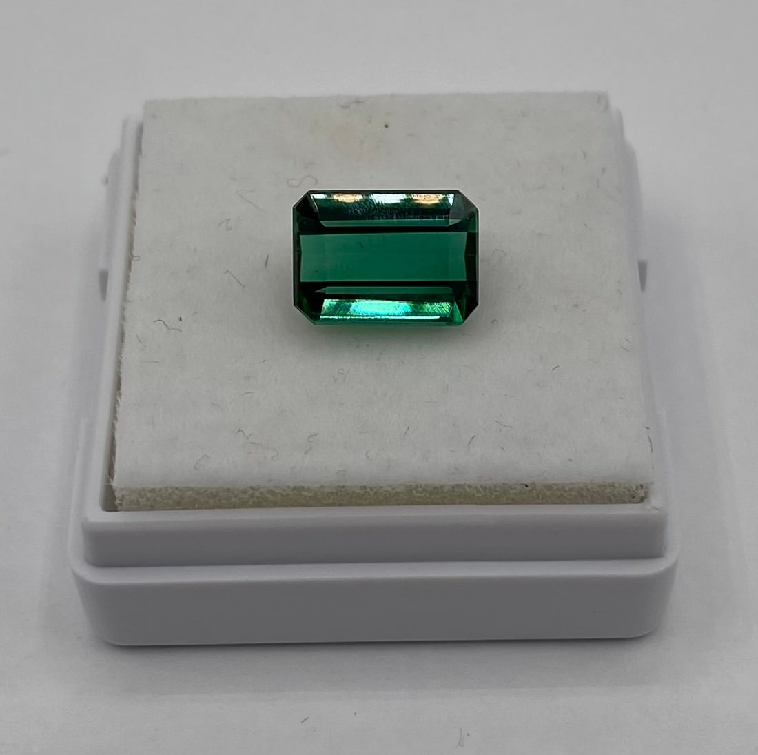 Natural Brazilian Green Tourmaline - Emerald Cut: Up for auction is a beautiful, loose Brazilian Green Tourmaline weighing approximately 2.70 carats. This gemstone features a classic, elegant emerald cut (rectangular step cut) that beautifully