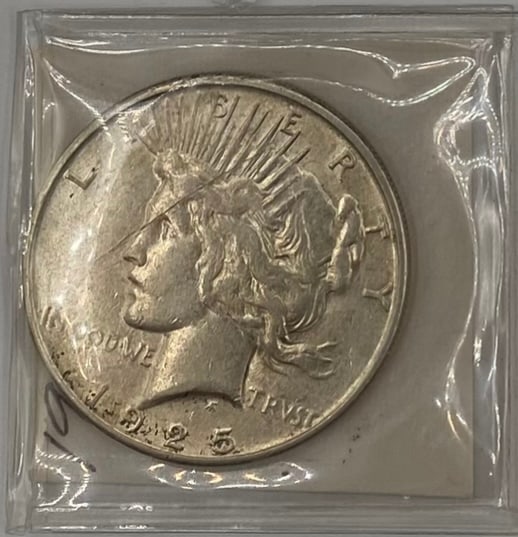 1925 S United States Peace Silver Dollar: An authentic, historical 1925 United States Peace Silver Dollar, designed by Anthony de Francisci to commemorate the restoration of peace following World War I. Obverse: Features the left-facing