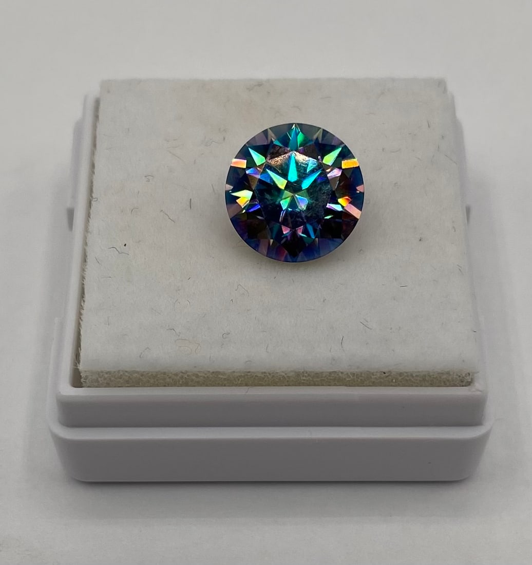Rainbow Green Moissanite: Enhance your collection with this mesmerizing 3-carat loose Moissanite gemstone. This stone displays a captivating "Peacock" or "Mystic" blue-green coloration, radiating intense rainbow-like flashes