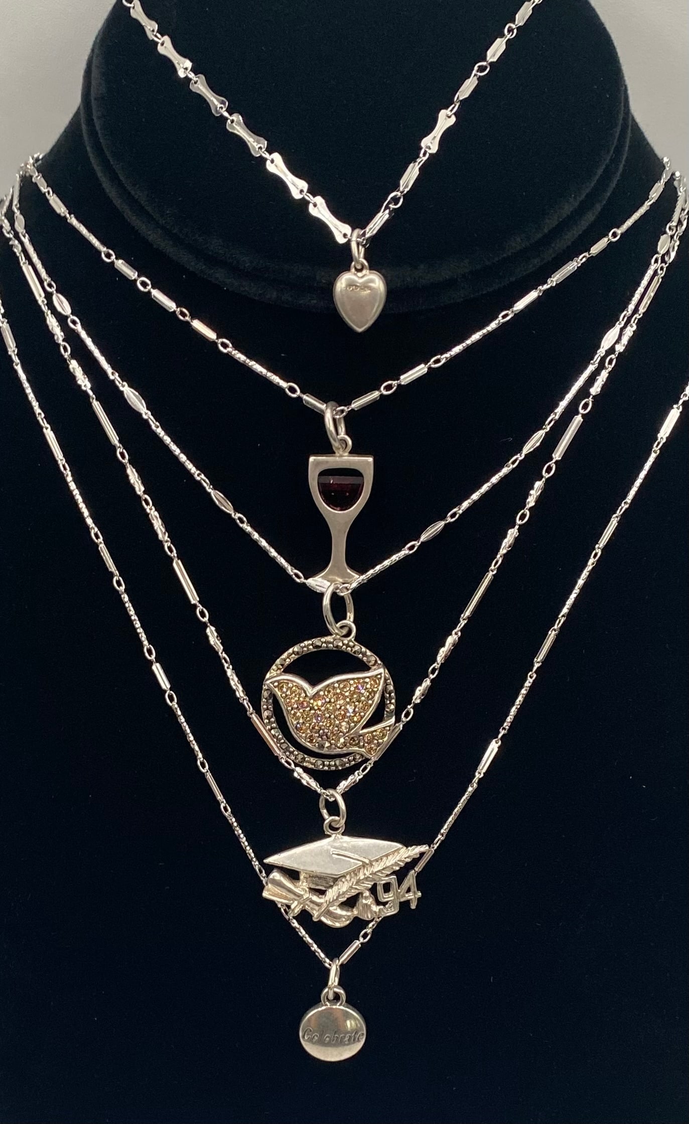 Vintage Sterling Silver Pendant Necklace Lot (5 Pcs) - Graduation '94, Dove, Wine Glass: An eclectic and charming assortment of five (5) vintage sterling silver pendant necklaces, beautifully displayed and ready for resale, gifting, or adding to a personal collection. This curated lot fea