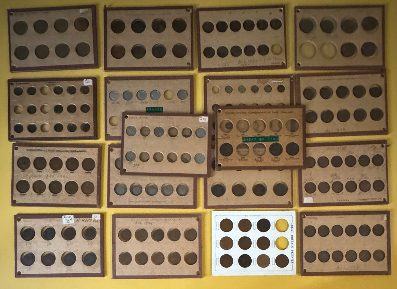 Great Britain, France, Ireland, US Commemoratives & More 18 Albums: An exceptional estate-found hoard of vintage world and United States coins, meticulously housed across 18 classic Wayte Raymond cardboard coin pages/holders. Wayte Raymond holders are highly sought