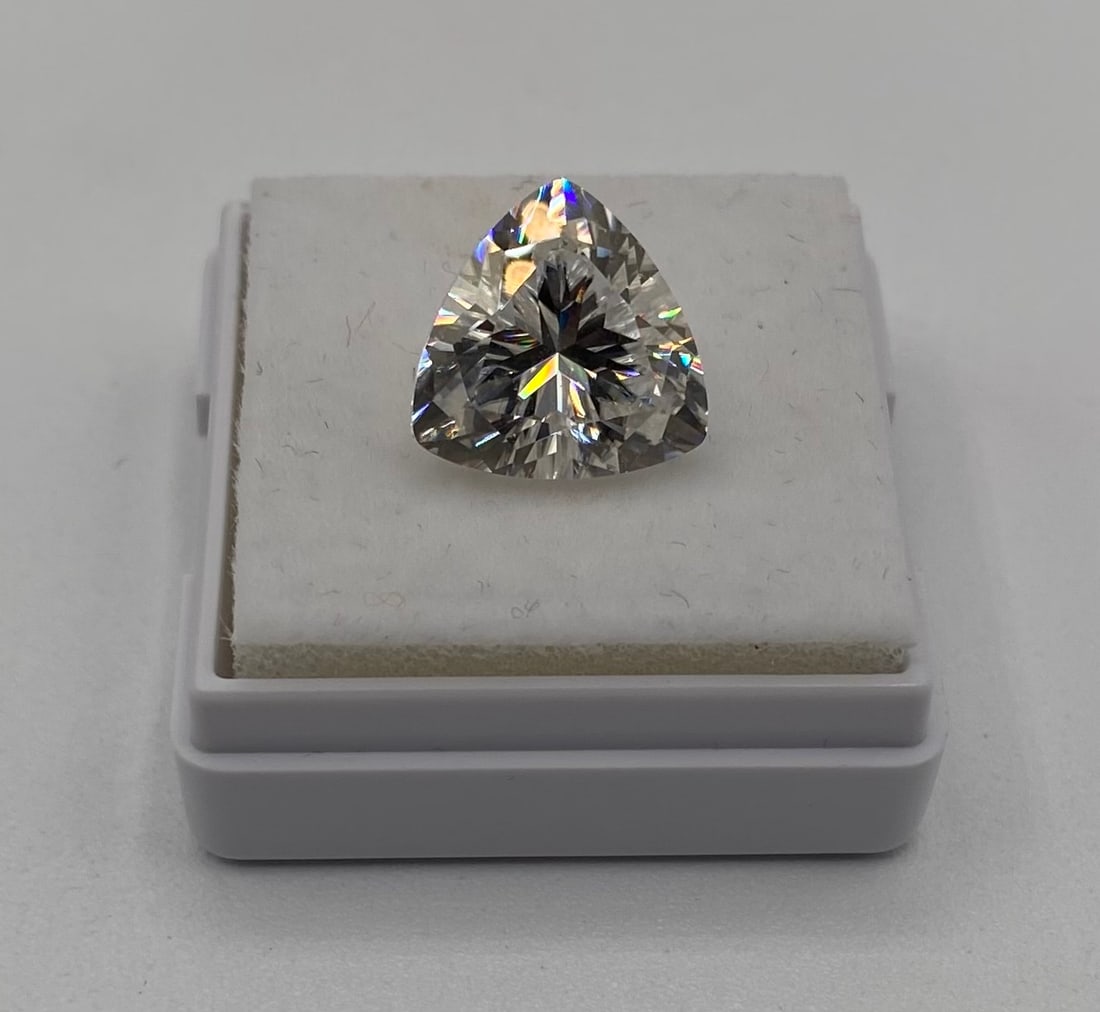 5.00 Carat Trillion Cut Moissanite Loose Gemstone - GRA Certified: Carat Weight: 5.00 Ct Shape/Cut: Trillion Cut (Triangular Brilliant) Certification: GRA Certified (Certificate included) Testing: Passes standard thermal diamond tester