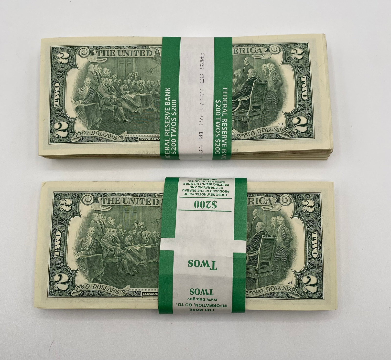 (2) Two Hundred Dollar Bills Bundle: Up for sale is a total face value of $400 in United States two-dollar bills, divided into two distinct brick/bundles of 100 bills each. Great for collectors, gifts, or unique cash reserves. Bundle 1: 