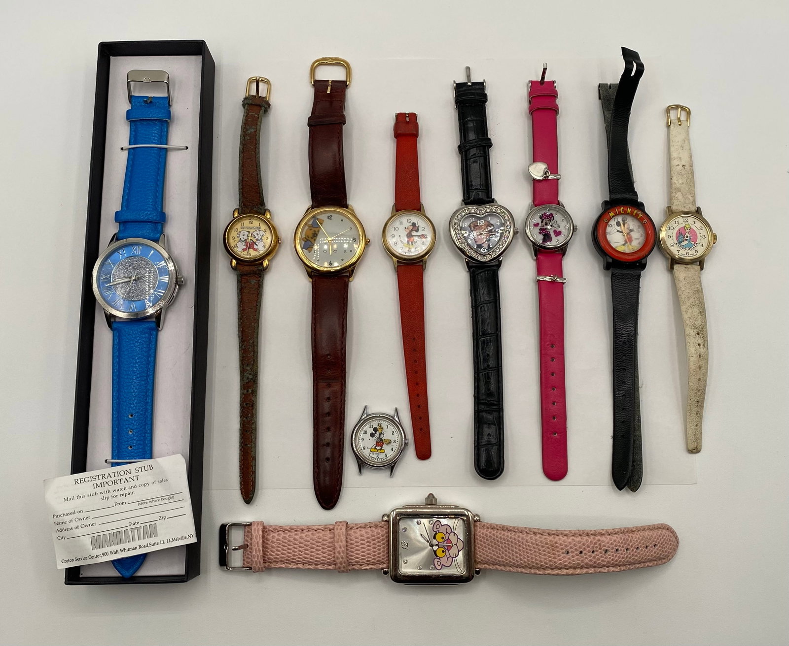 Vintage Character & Watch Lot - Disney, Pink Panther, 101 Dalmatians (10 Pcs): A charming 10-piece collection of novelty and character-themed wristwatches, heavily featuring nostalgic pop-culture favorites. Ideal for collectors or repair/parts. Character Watches: Includes multip