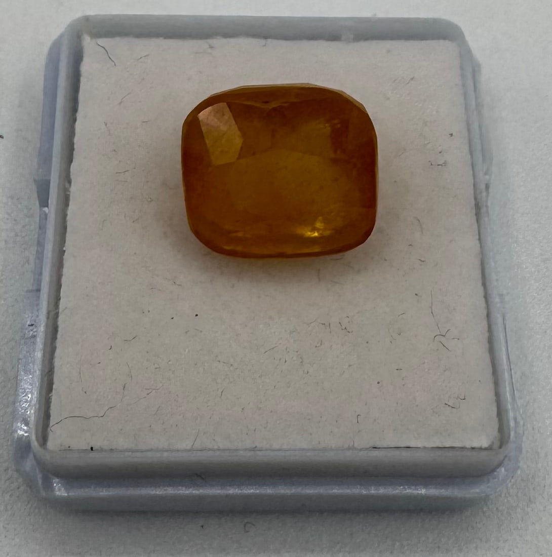 12.42 Cts Natural Cushion Cut Yellow Sapphire Gemstone: 12.42 Cts Natural Cushion Cut Yellow Sapphire Gemstone. Variety: Natural Sapphire Species/Group: Corundum Weight: 12.42 Cts Colour: Yellow Shape / Cut: Cushion / Mixed Dimension: 12.06 x 10.49 x 8.20