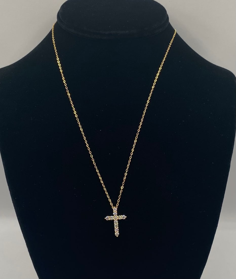 Moissanite Cross Pendant Necklace 18K Gold over Sterling Silver: Moissanite 2.5mm Cross Pendant Necklace 18K Gold over Sterling Silver. Size: 2.5mm Chain Length: Approx. 18 inches Inclusions: Accompanied by an official gemstone certificate of authenticity. Conditio