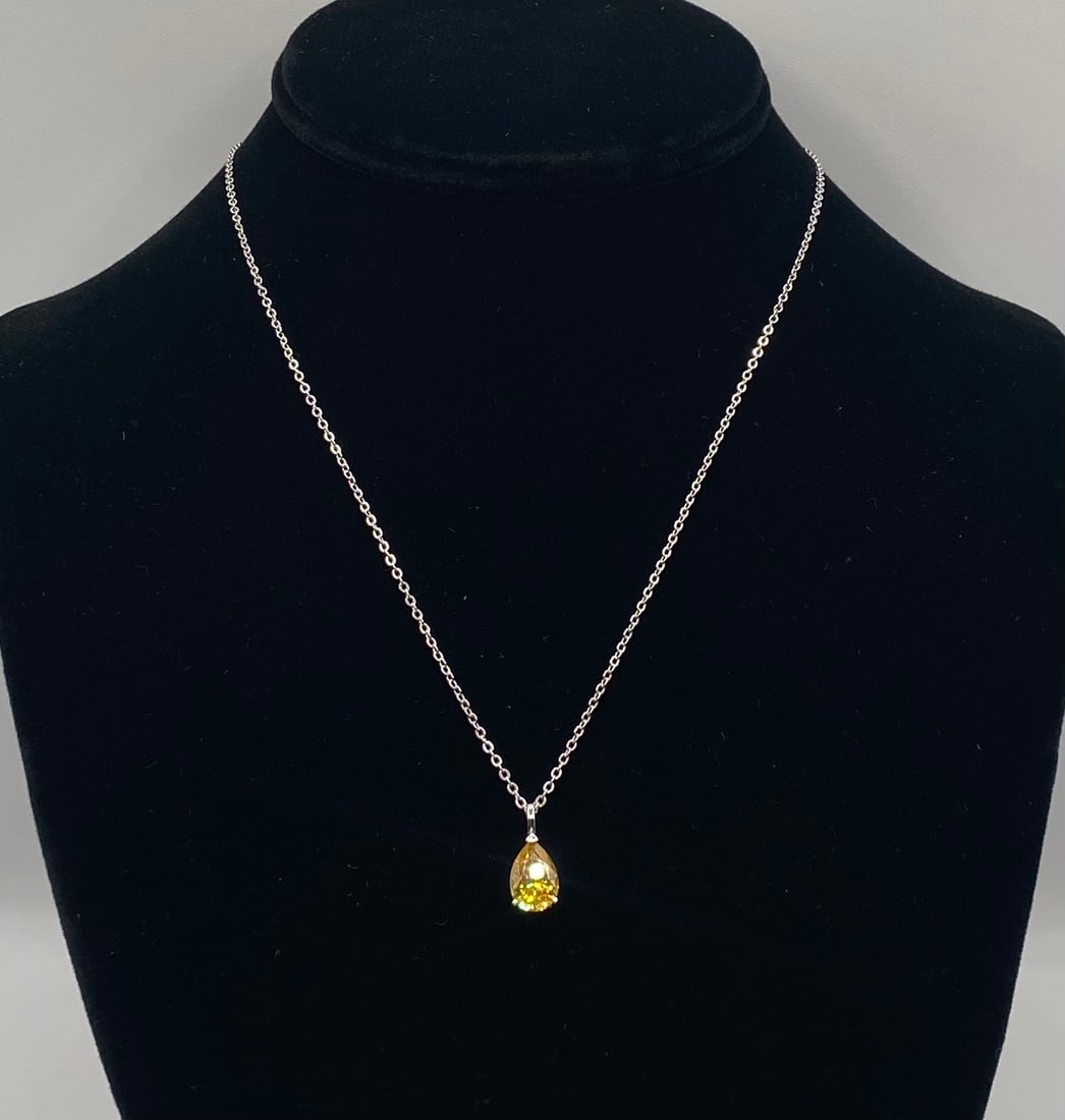 2.00 CT Pear Cut Yellow Moissanite Pendant Necklace 18K White Gold Finish: 2.00 CT Pear Cut Yellow Moissanite Pendant Necklace 18K White Gold Finish. Material: 18K White Gold / Rhodium plated over premium Sterling Silver Gemstone: Genuine Yellow Moissanite (Passes as
