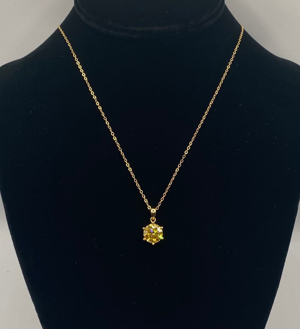 4.00 CT Round Brilliant Canary Yellow Moissanite Pendant Necklace 18K Gold: 4.00 CT Round Brilliant Canary Yellow Moissanite Pendant Necklace 18K Gold. Material: 18K Yellow Gold plated over premium Sterling Silver Gemstone: Genuine Canary Yellow Moissanite (Passes as diamond
