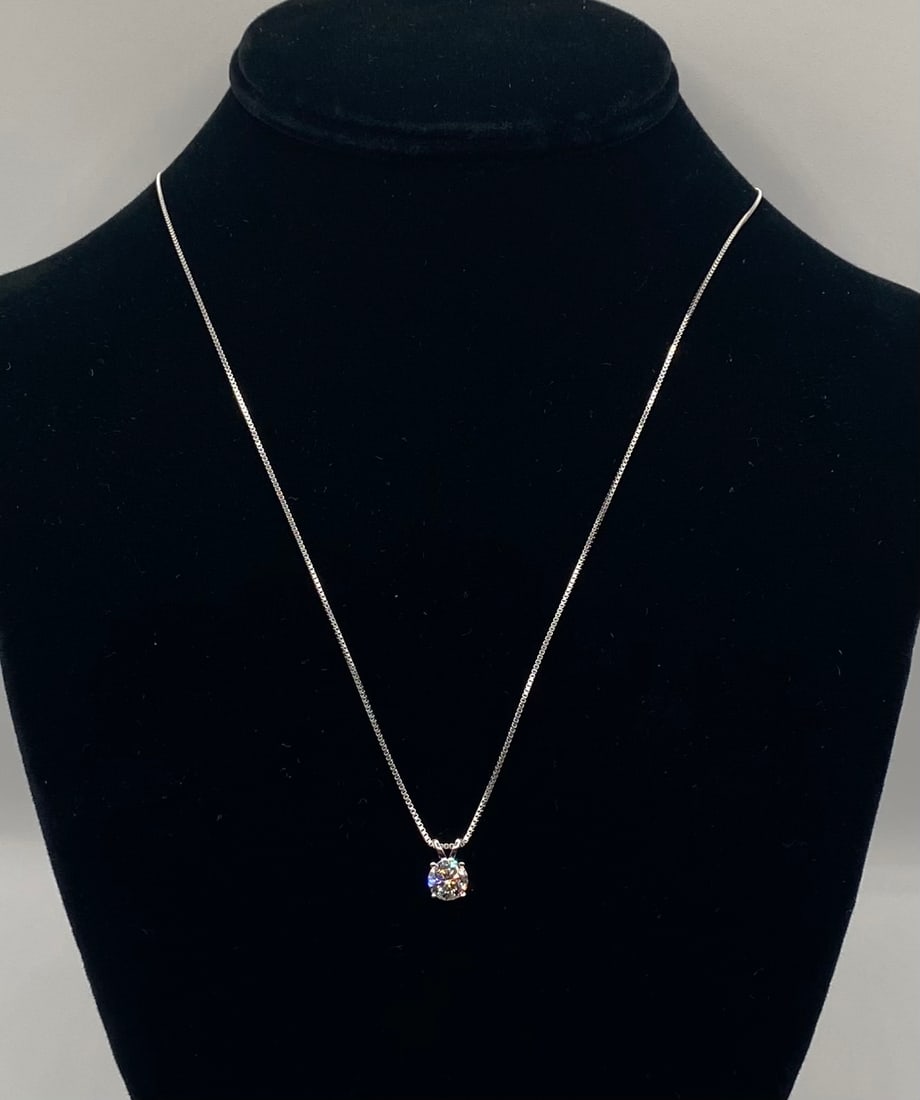 Round Cut Moissanite Solitaire Pendant Necklace 18K Gold Over Silver: Round Cut Moissanite Solitaire Pendant Necklace 18K Gold Over Silver Material: 18K White Gold plated over premium Sterling Silver Gemstone: Genuine Clear Moissanite (Passes as diamond on standard