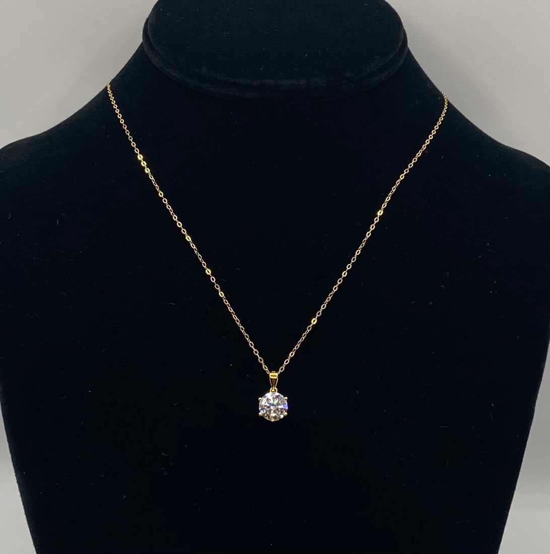 2 Carats Round Cut Moissanite Solitaire Pendant Necklace 18K Gold Over Silver: 2 Carats Round Cut Moissanite Solitaire Pendant Necklace 18K Gold Over Silver. Material: 18K Yellow Gold plated over premium Sterling Silver Gemstone: Genuine Clear Moissanite (Passes as diamond on