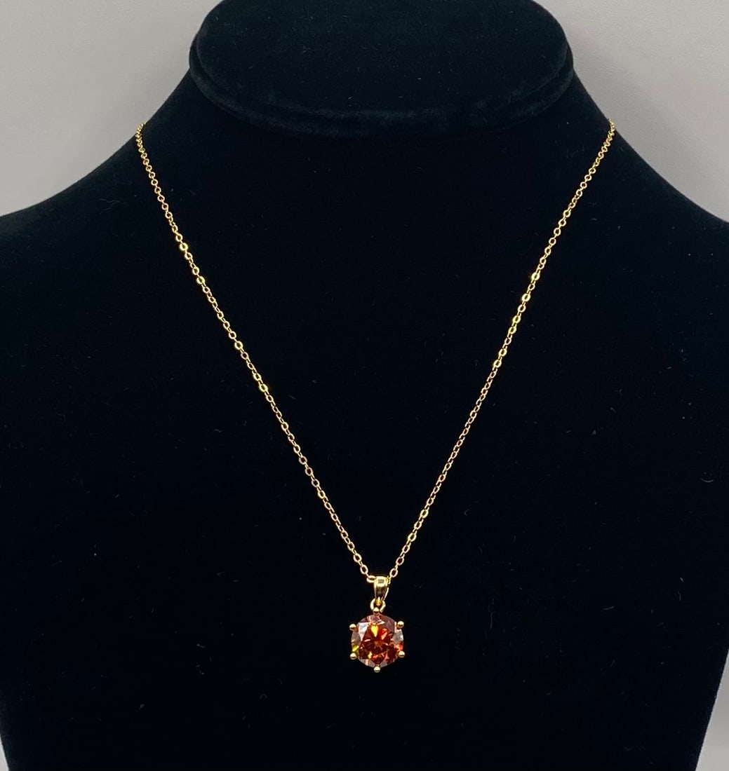 4.00 CT Round Brilliant Cognac Amber Moissanite Pendant Necklace 18K Gold: 4 CT Round Brilliant Cognac Amber Moissanite Pendant Necklace 18K Gold Material: 18K Yellow Gold plated over premium Sterling Silver Gemstone: Genuine Cognac/Amber Moissanite (Passes as diamond on
