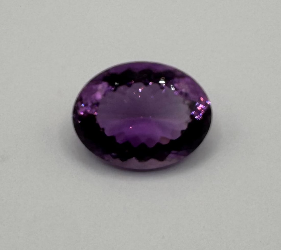 Natural Violet Amethyst Loose Gemstone - 29.25 Cts: Natural Violet Amethyst Loose Gemstone - 29.25 Cts. Species: Quartz Variety: Natural Amethyst Weight: 29.25 Cts Color: Violet Shape/Cut: Oval / Mixed Dimensions: 24.21 x 8.60 x 11.48 mm
