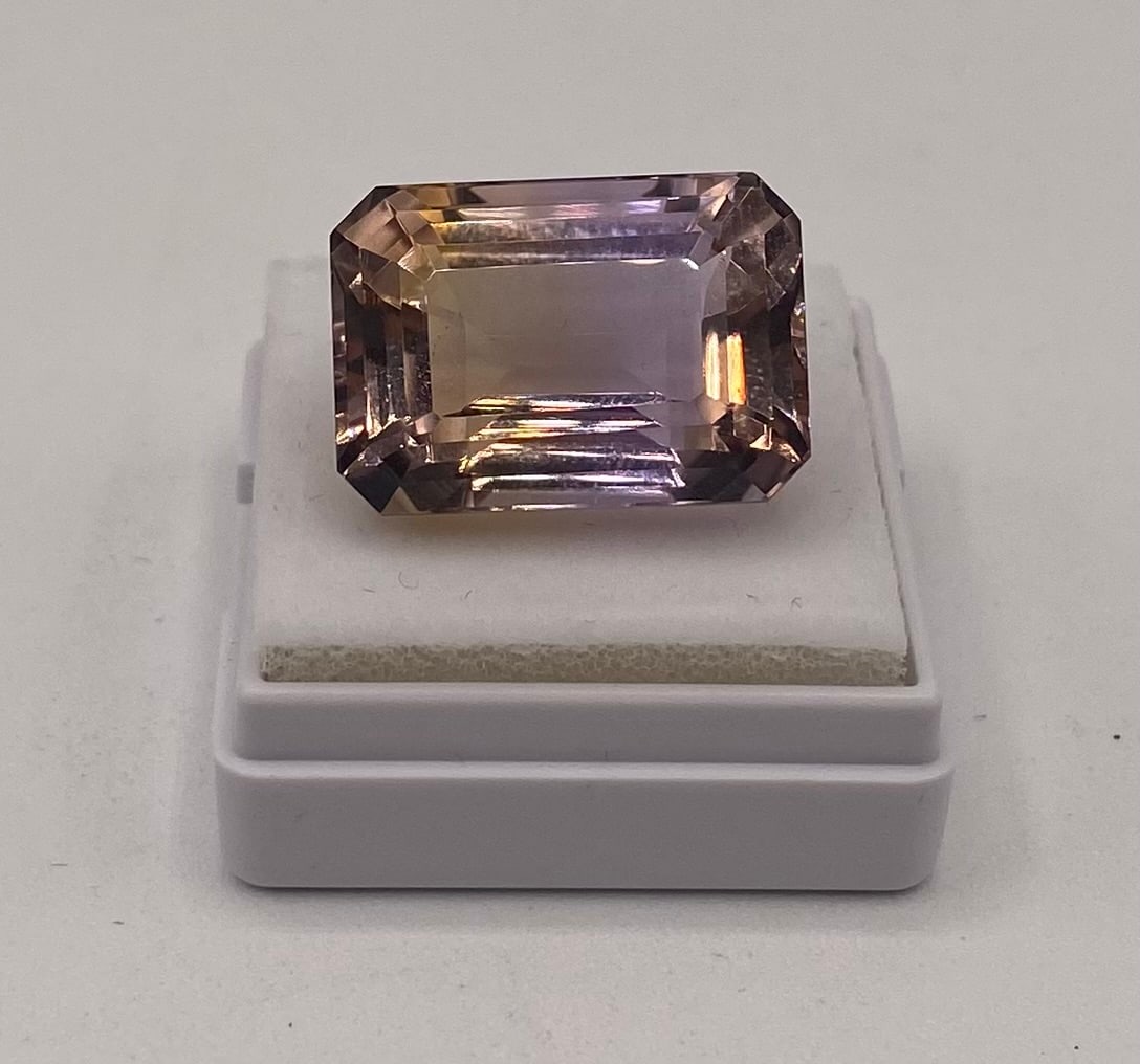 Natural Bicolor Ametrine Loose Gemstone - 20.78 Cts: Natural Ametrine Loose Gemstone - 20.78 Cts. Variety: Natural Ametrine Weight: 20.78 Cts Color: Violet / Yellow Shape/Cut: Octagon / Step Dimensions: 18.74 x 13.22 x 10.93 mm