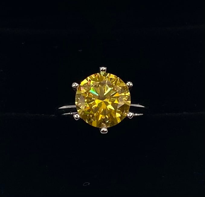 Yellow VVS1 Moissanite Ring: Vibrant 5.00ct Canary Yellow Moissanite Solitaire Ring Sterling Silver - Size 7. Stone: 5.00 Carat striking canary yellow round-cut Moissanite stone with a classic 6-prong setting. Metal: 18K white
