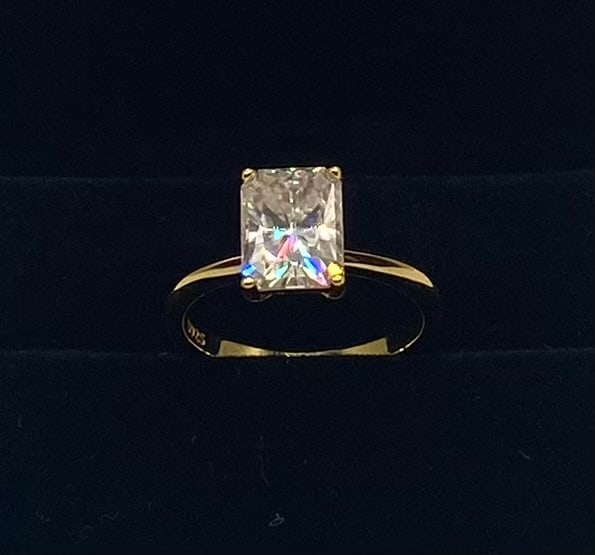 3 Carats Radiant VVS Ring: 3 Carats Emerald-Cut Moissanite Solitaire Ring 18K Gold Plated Sterling Silver - Size 7 Stone: 3.00 Carat classic rectangular emerald/radiant-cut Moissanite step-cut center stone. Metal: 18K yellow