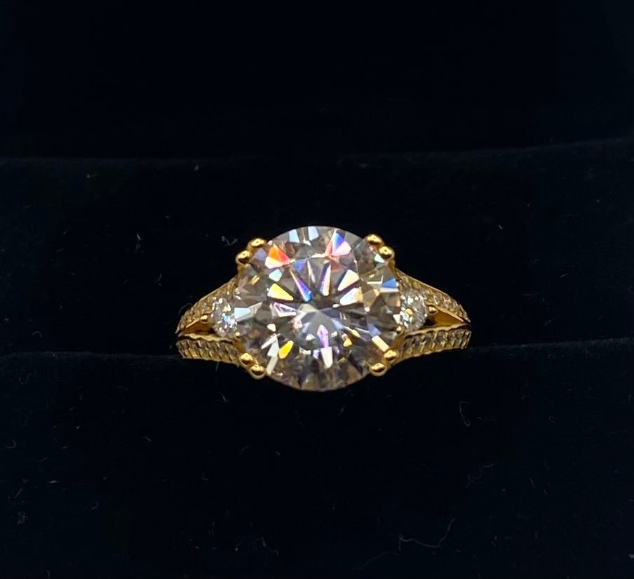 5 Carats VVS Ring: 5.00CT VVS1 Moissanite Ring 18K Yellow Gold Plated Sterling Silver - Size 7 1/2. Center Stone Weight: 5.00 Carats Gemstone Type: Genuine Moissanite (Passes diamond tester) Metal Composition: 18K