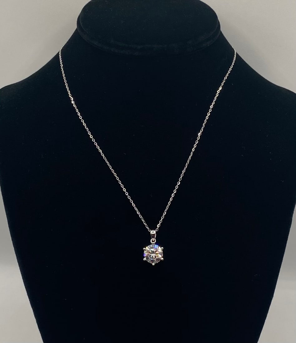 Elegant 4.00 Carat Moissanite Pendant Necklace: Elegant 4.00 Carat Moissanite Solitaire Pendant Necklace. Gemstone: Genuine Moissanite (Passes Diamond Tester) Total Carat Weight: 3.00 Carats Metal Composition: 18K White Gold Plated over Premium