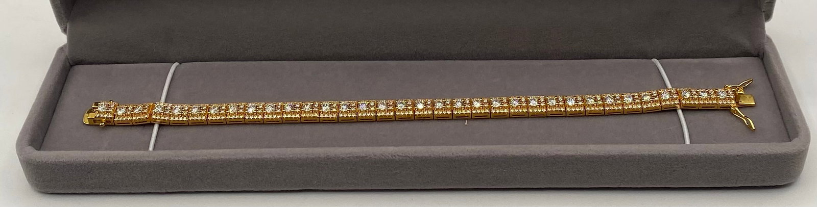 5mm VVS1 Moissanite Double-Row Tennis Bracelet Gold Finish: 5mm VVS1 Moissanite Double-Row Tennis Bracelet Gold Finish 7 Inches. Item Type: Double-Row Round-Cut Tennis Bracelet Stone Type: Genuine Moissanite (Passes positive on thermal diamond
