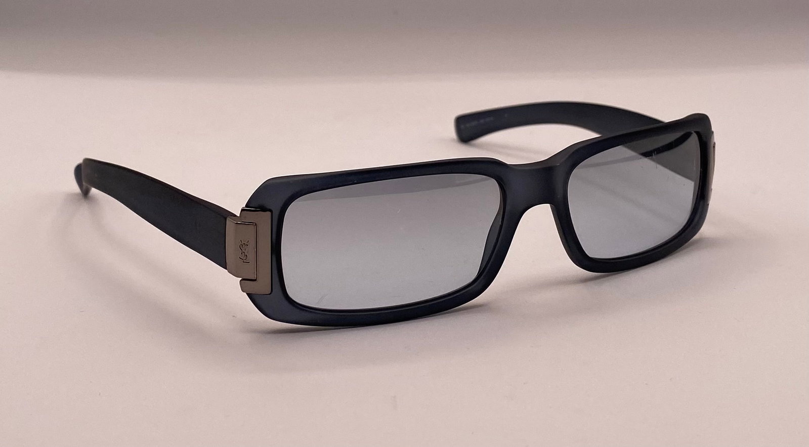 Yves Saint Laurent Sunglasses: Yves Saint Laurent YSL 6006/S Matte Dark Blue Rectangle Sunglasses. Up for auction is an authentic pair of pre-owned Yves Saint Laurent (YSL) sunglasses (Model: YSL 6006/S 4MO 53-16). Featuring a matt