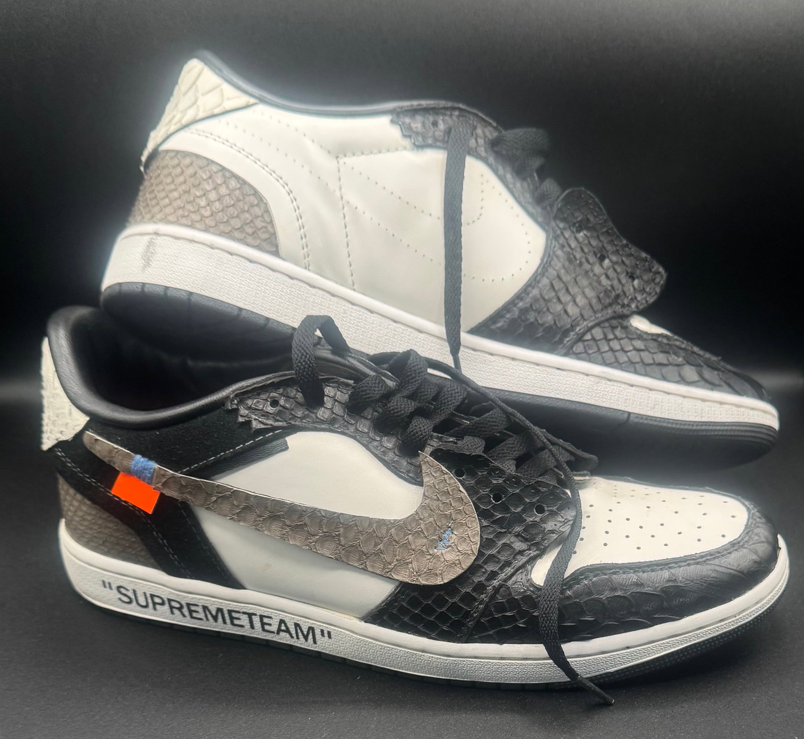 Custom Air Jordan 1 Low "Off-White / Supreme Team" Snakeskin Bespoke: Custom Air Jordan 1 Low "Off-White / Supreme Team" Snakeskin Bespoke - Size US 12. Model Base: Air Jordan 1 Low (Custom / Bespoke Reconstruction) Size: US 12 Colorway: White / Black / Grey Exotic