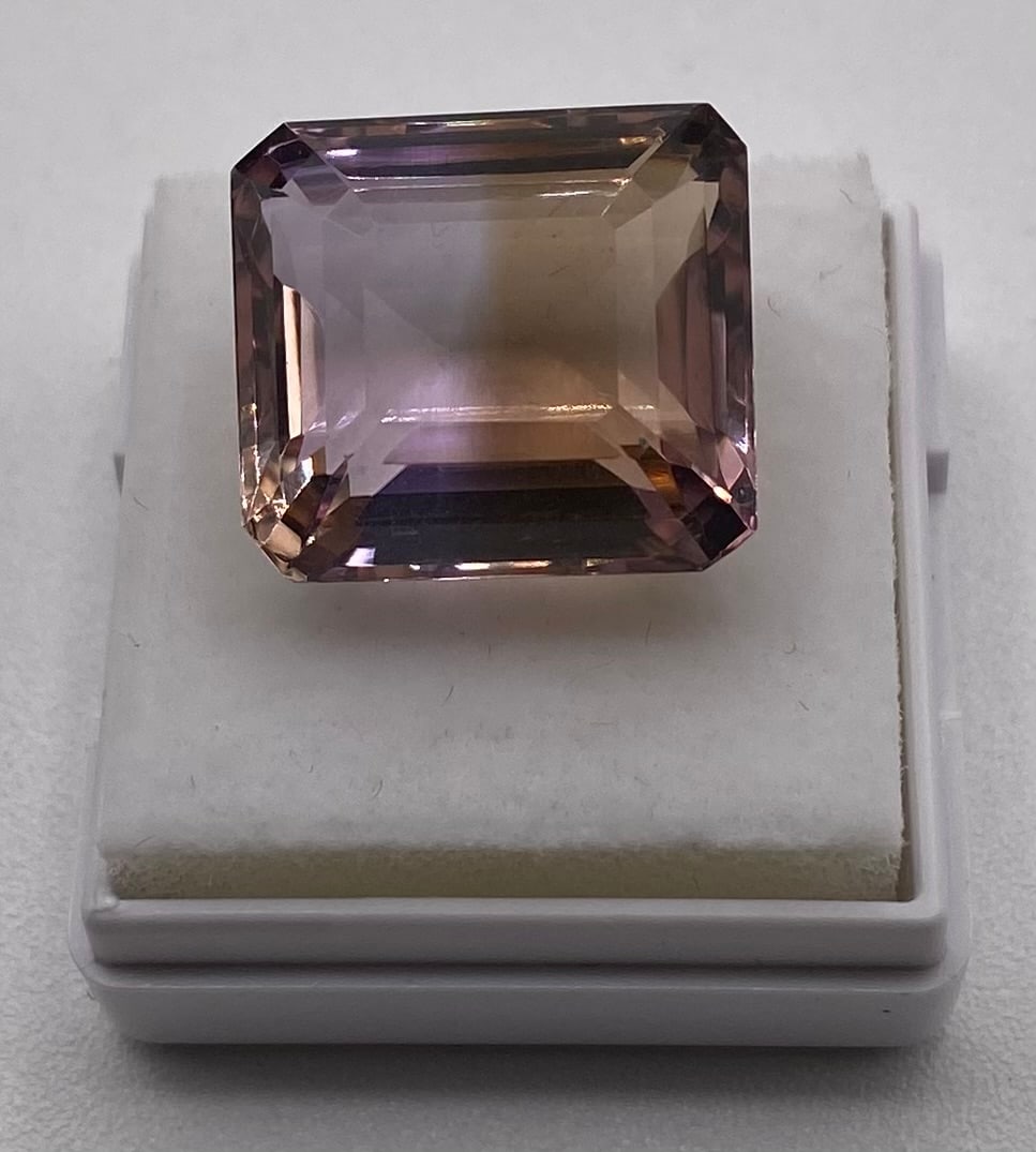 Certified 19.28 Cts Natural Ametrine: Gem Type: Natural Ametrine (Quartz) Weight: 19.28 Cts Color: Violet / Yellow (Bi-color) Shape / Cut: Octagon / Step Cut Dimensions: 16.45 x 14.92 x 10.27 mm Refractive Index: 1.540 - 1.55