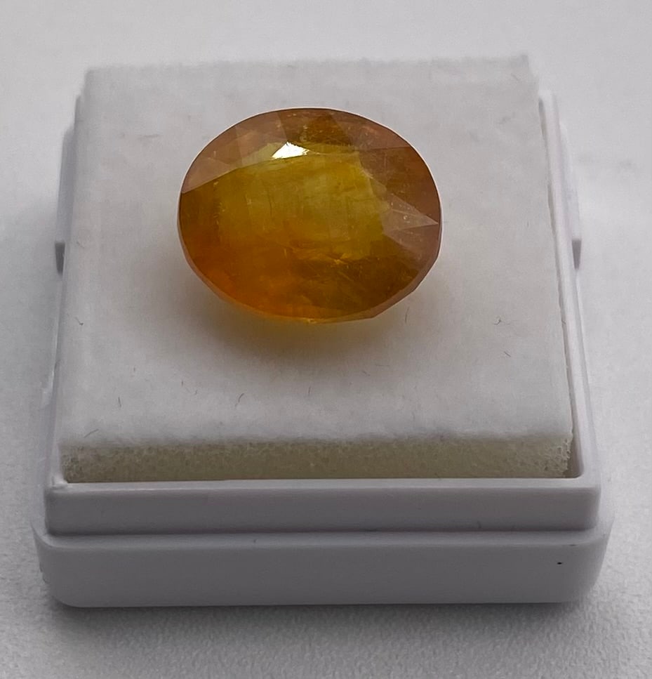 Certified 10.07 Cts Natural Yellow Sapphire - ITLGJ: Gem Type: Natural Sapphire (Corundum) Weight: 10.07 Cts Color: Yellow Shape / Cut: Oval / Mixed Cut Dimensions: 13.36 x 11.45 x 6.67 mm Refractive Index: 1.760 - 1.770 (Birefringence