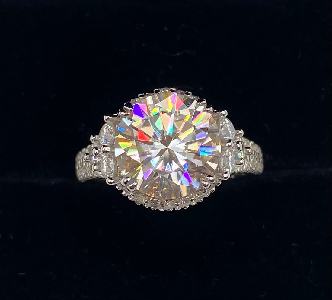 5 Carats VVS Ring: 18K Gold Plated Sterling Silver Ring — 10 CTW VVS D Moissanite (Size 8) Key Details Material: 18K Gold Plated .925 Sterling Silver Main Stone: Lab-Created VVS Moissanite Total Carat Weight: 5