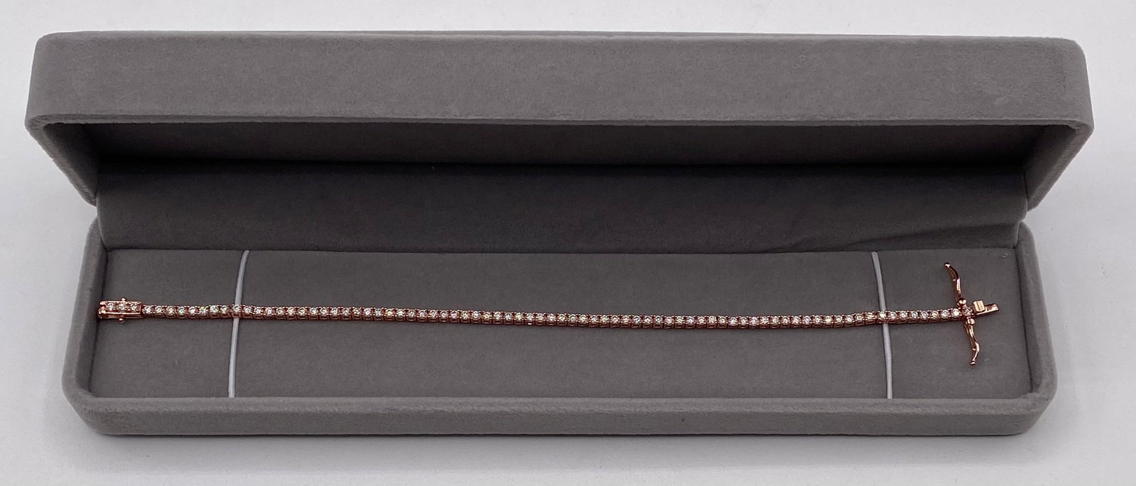 2mm VVS1 D-Color Moissanite Classic Tennis Bracelet Rose Gold Over 925 Silver w/ COA: Up for auction is a elegant 2mm VVS1 D-Color Moissanite Classic Single-Row Tennis Bracelet crafted in Rose Gold Plated 925 Sterling Silver. Featuring continuous round brilliant-cut stones in a classic