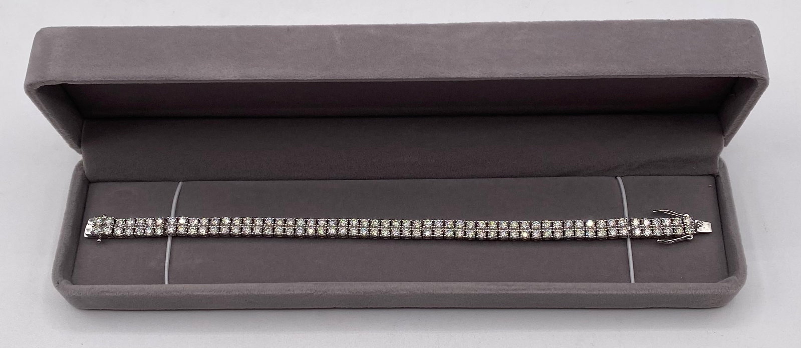 8" Double Row VVS1 D-Color Moissanite Tennis Bracelet in 925 Sterling Silver (6mm): Up for auction is a high-impact Double-Row VVS1 D-Color Moissanite Tennis Bracelet crafted in solid 925 Sterling Silver. Featuring two parallel rows of brilliant 3mm round-cut stones (6mm total bracel