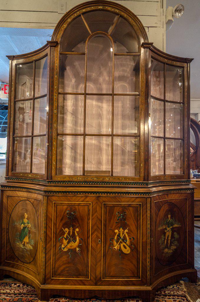 Edwardian Satinwood China cabinet: Edwardian Satinwood China cabinet, handpainted inlay with glass shelving and display lighting. 3 bottom storage cabinets & pull out center drawer 68" x 20" 88" h