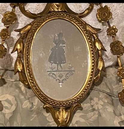 Gilt Floral Garland Double Arm Mirrored Sconces: Gilt Floral Garland Double Arm Mirrored Sconces from a Newport Mansion. there are etched figures on the mirror centers