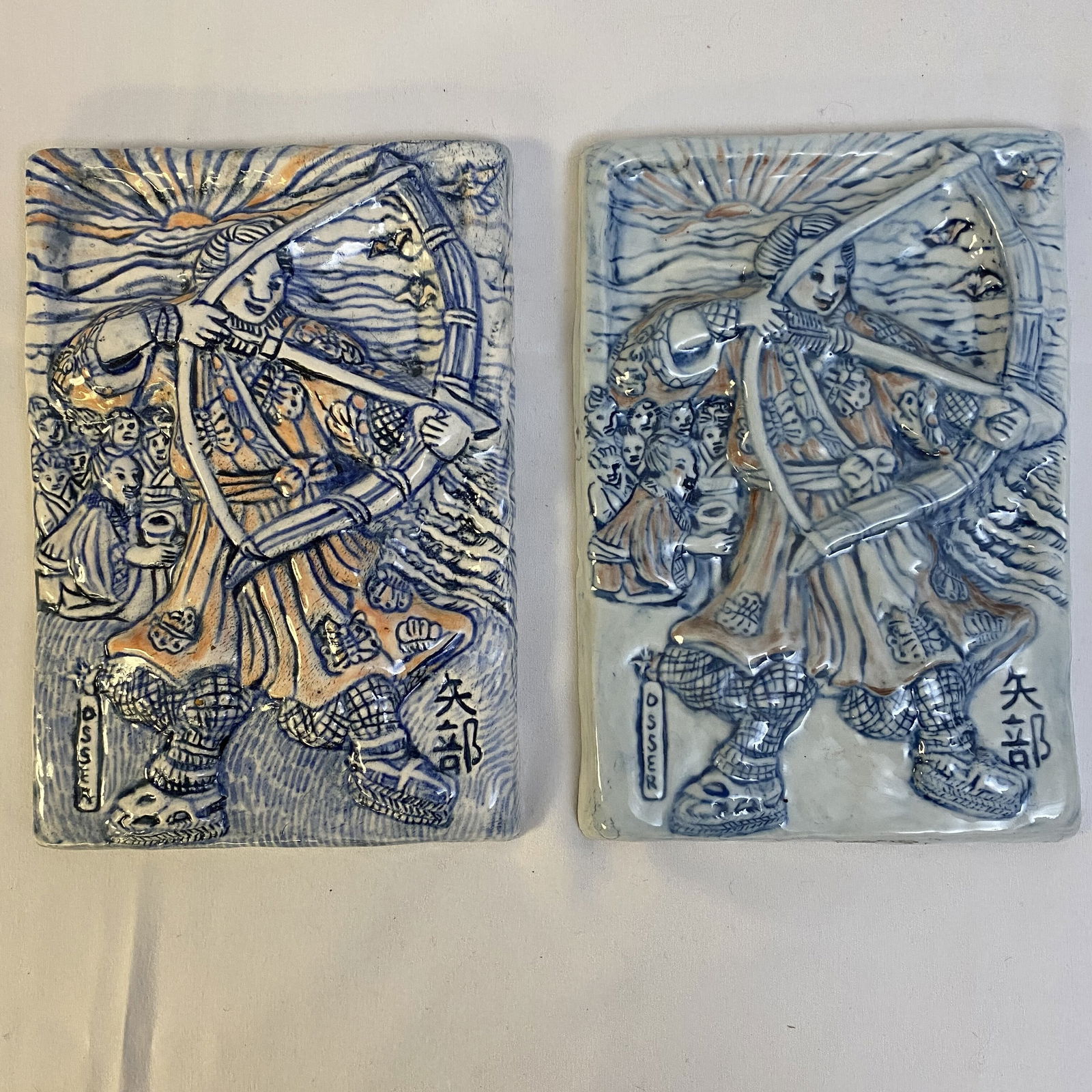 Pair of Ceramic Tiles by Stephanie Osser: Pair of Ceramic Tiles by Stephanie Osser signed on back depicting archers