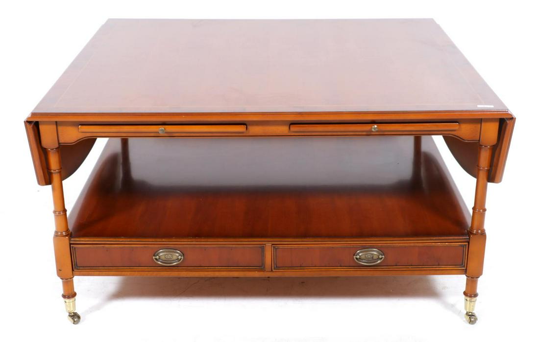 Cherry wood coffee table resting on copper wheels, h.53 x w. ... (1 of 4)