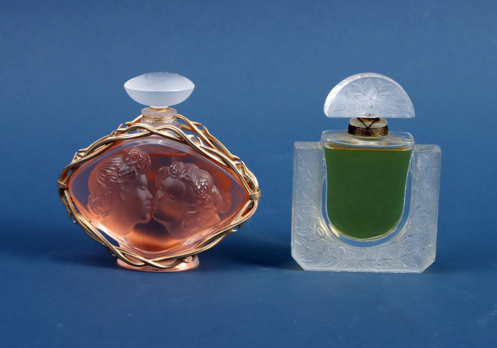 Lalique France, Le Baiser, edition limitÃ©e 1999 and Lalique ...: Lalique France, Le Baiser, edition limitÃ©e 1999 and Lalique by Lalique, glass flasks with content, h.11 cm.
