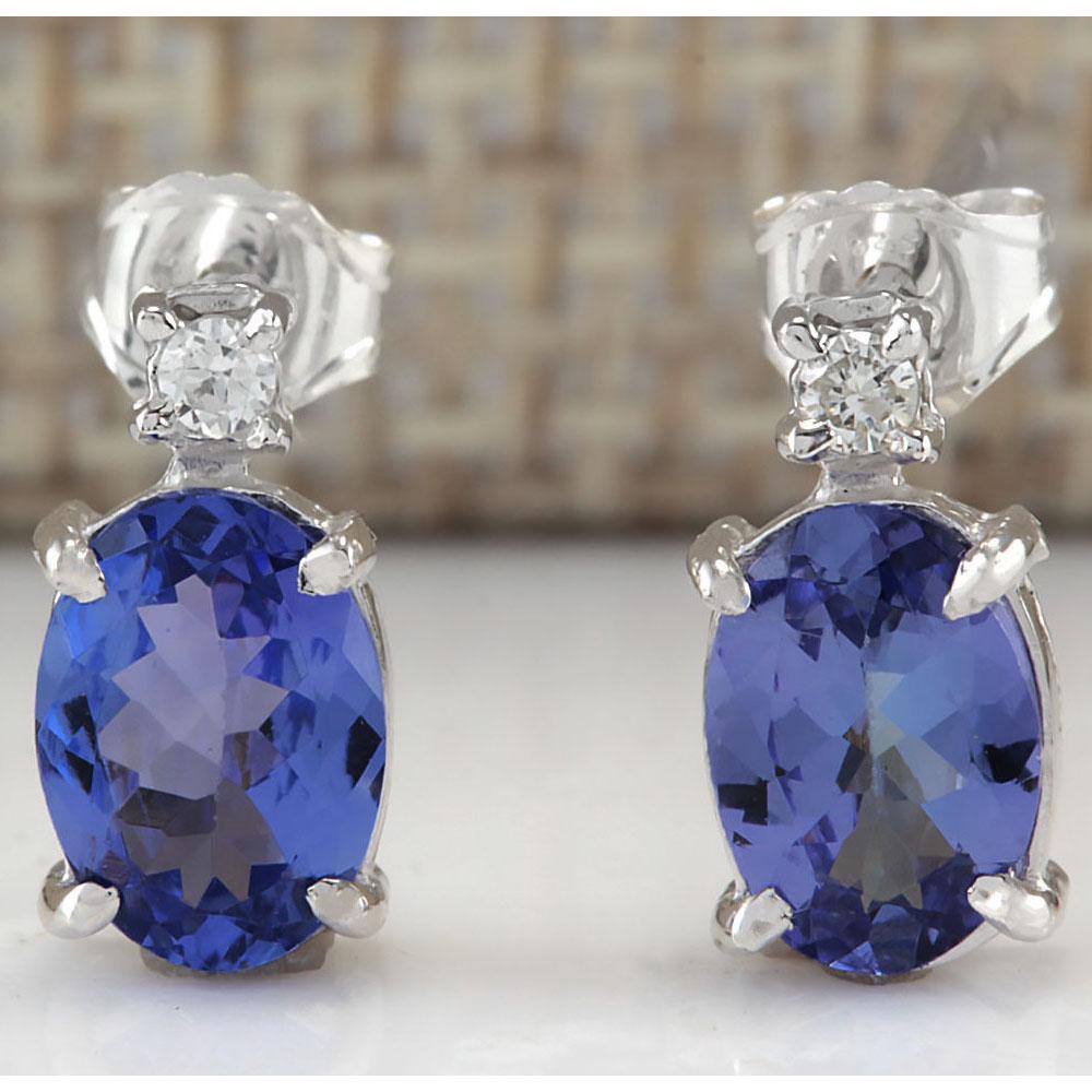 1.73 CTW Natural Blue Tanzanite And Diamond Earrings: 1.73 CTW Natural Blue Tanzanite And Diamond Earrings 18K Solid White Gold Manufacturer's Suggested Retail Price: $ 1350.00 Stamped: 18K Total Earring Weight: 1.4Grams Diamond Weight: Total Natural dia
