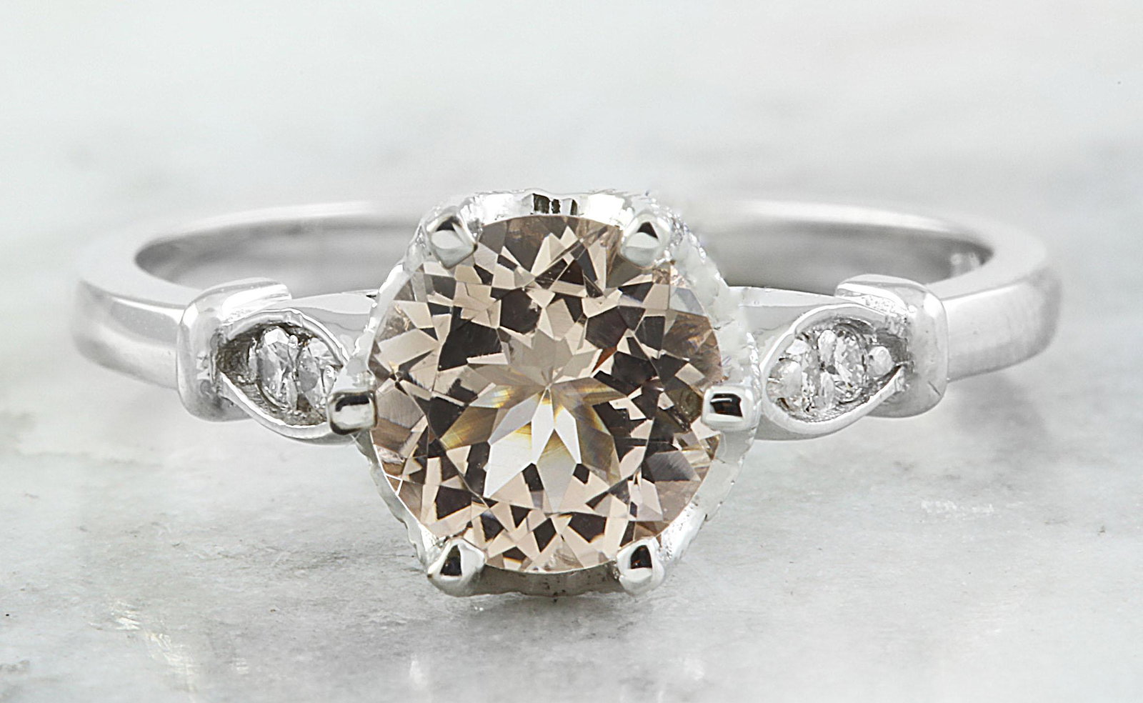 1.45 CTW Morganite 14K White Gold Diamond Ring: 1.45 CTW Morganite 14K White Gold Diamond Ring Manufacturer's Suggested Retail Price: $ 1700.00 Stamped: 14K Total Ring Weight: 3.4 Grams Morganite Weight 1.35 Carat (6.80x6.80 Millimeters) Diamond We
