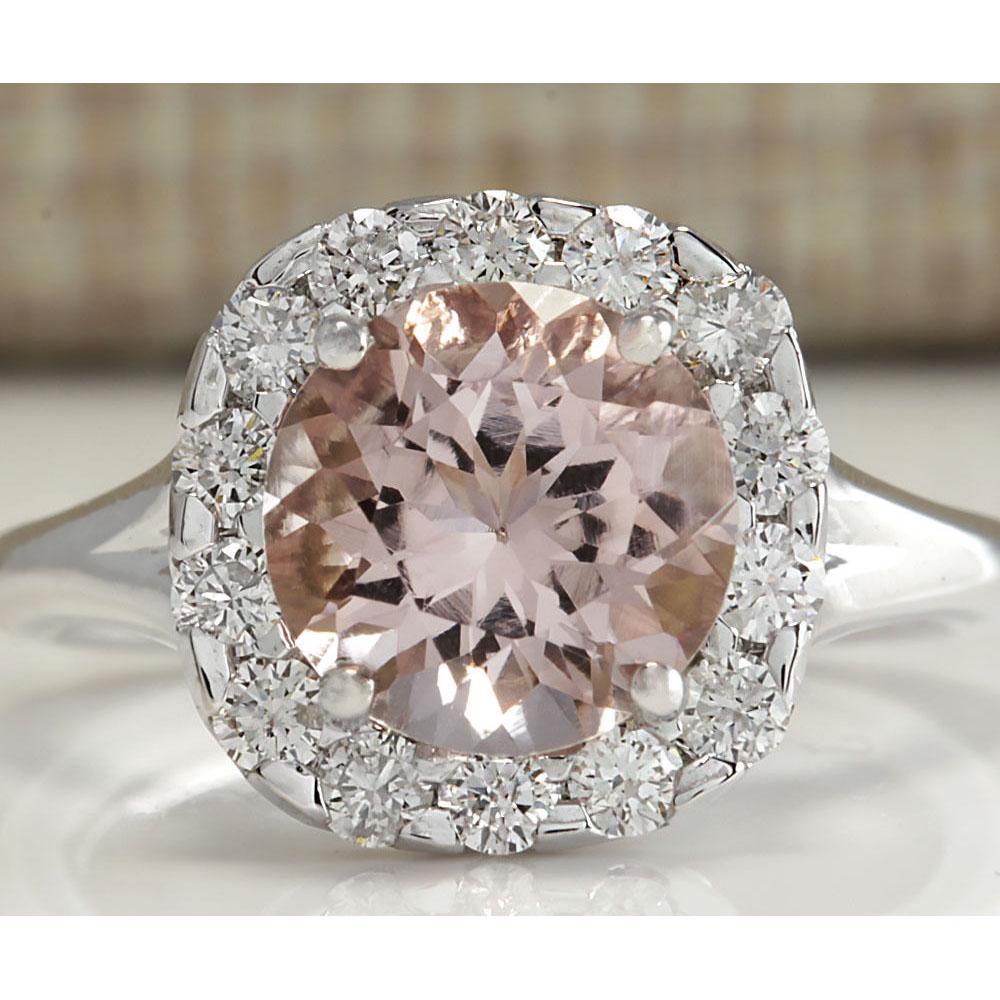 3.19 CTW Natural Peach Morganite And Diamond Ring In: 3.19 CTW Natural Peach Morganite And Diamond Ring In 18K Solid White Gold Manufacturer's Suggested Retail Price: $ 5050.00 Stamped: 18K Ring Size: 6 Total Ring Weight: 6 Grams Diamond Weight: Total Na