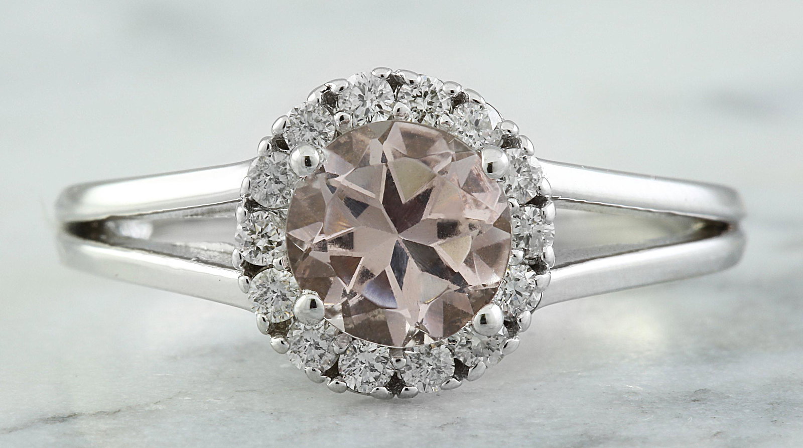 1.28 CTW Morganite 14K White Gold Diamond Ring: 1.28 CTW Morganite 14K White Gold Diamond Ring Manufacturer's Suggested Retail Price: $ 2200.00 Stamped: 14K Ring Size: 7 Total Ring Weight: 2.8 Grams Morganite Weight: 1.00 Carat (6.40x6.40 Millimete