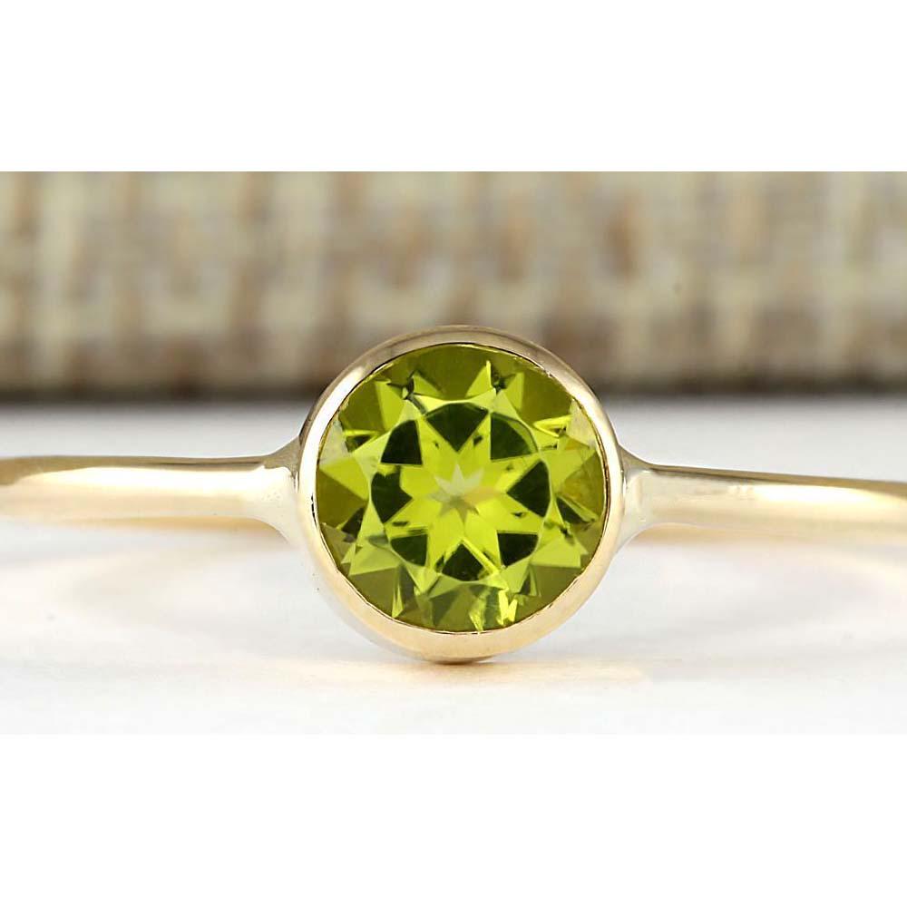 1.00 CTW Natural Peridot Ring In 18K Yellow Gold: 1.00 CTW Natural Peridot Ring In 18K Yellow Gold Manufacturer's Suggested Retail Price: $ 1350.00 Stamped: 18K Ring Size: 8 Total Ring Weight: 1.6 Grams Gemstone Weight: Total Natural Peridot Weight i