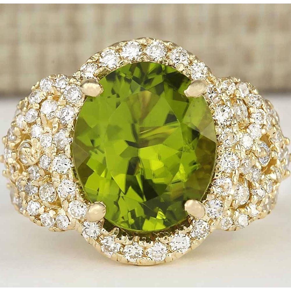 8.02 CTW Natural Peridot And Diamond Ring In 14k Yellow: 8.02 CTW Natural Peridot And Diamond Ring In 14k Yellow Gold Manufacturer's Suggested Retail Price: $ 7950.00 Stamped: 14K Ring Size: 7.25 Total Ring Weight: 10 Grams Diamond Weight: Total Natural dia
