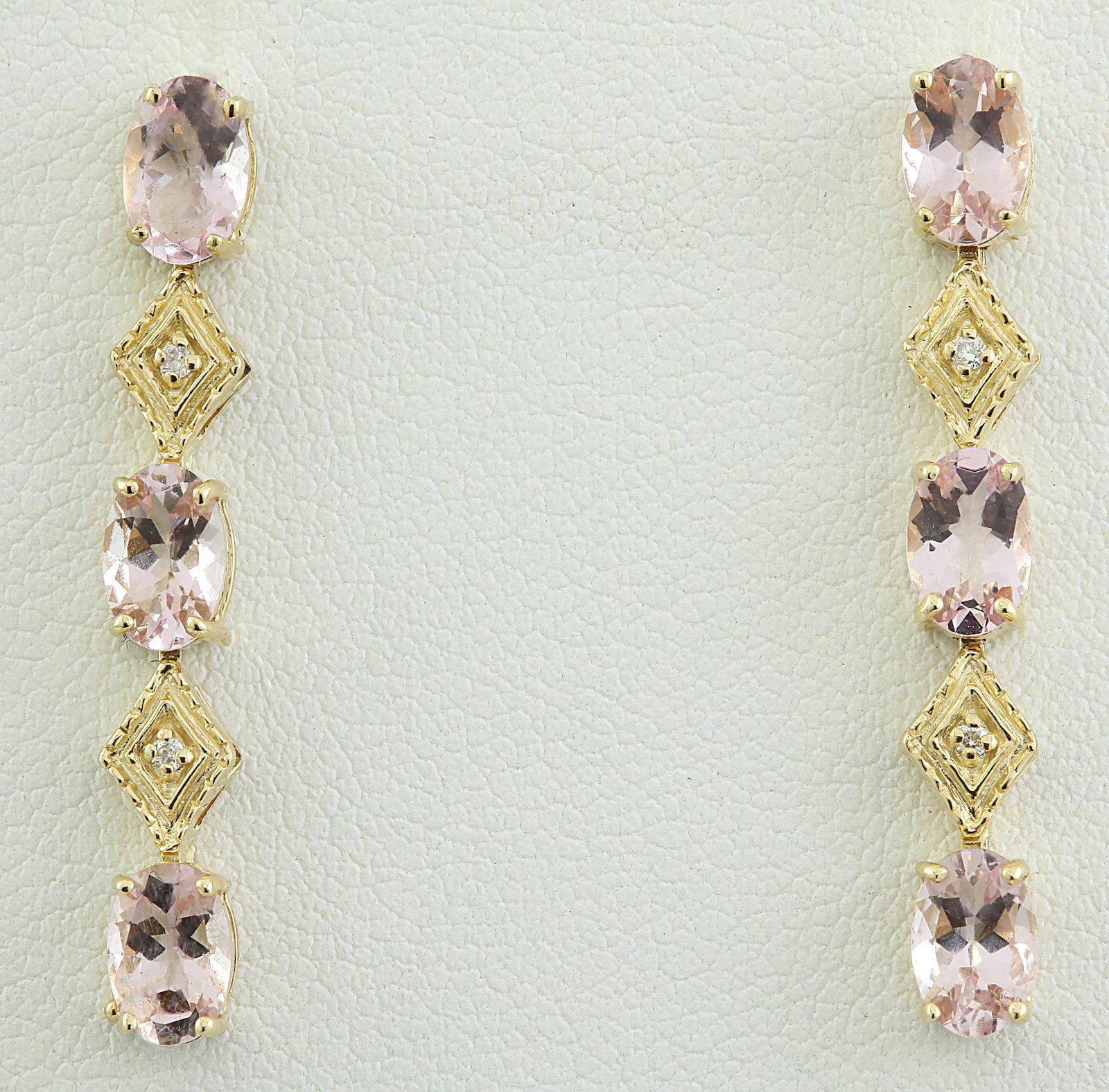 2.65 CTW Morganite 18K Yellow Gold Diamond Earrings: 2.65 CTW Morganite 18K Yellow Gold Diamond Earrings Manufacturer's Suggested Retail Price: $ 1800.00 Stamped: 18K Total Earrings Weight: 1.6 Grams Morganite Weight: 2.60 Carat (6.00x4.00 Millimeters) 